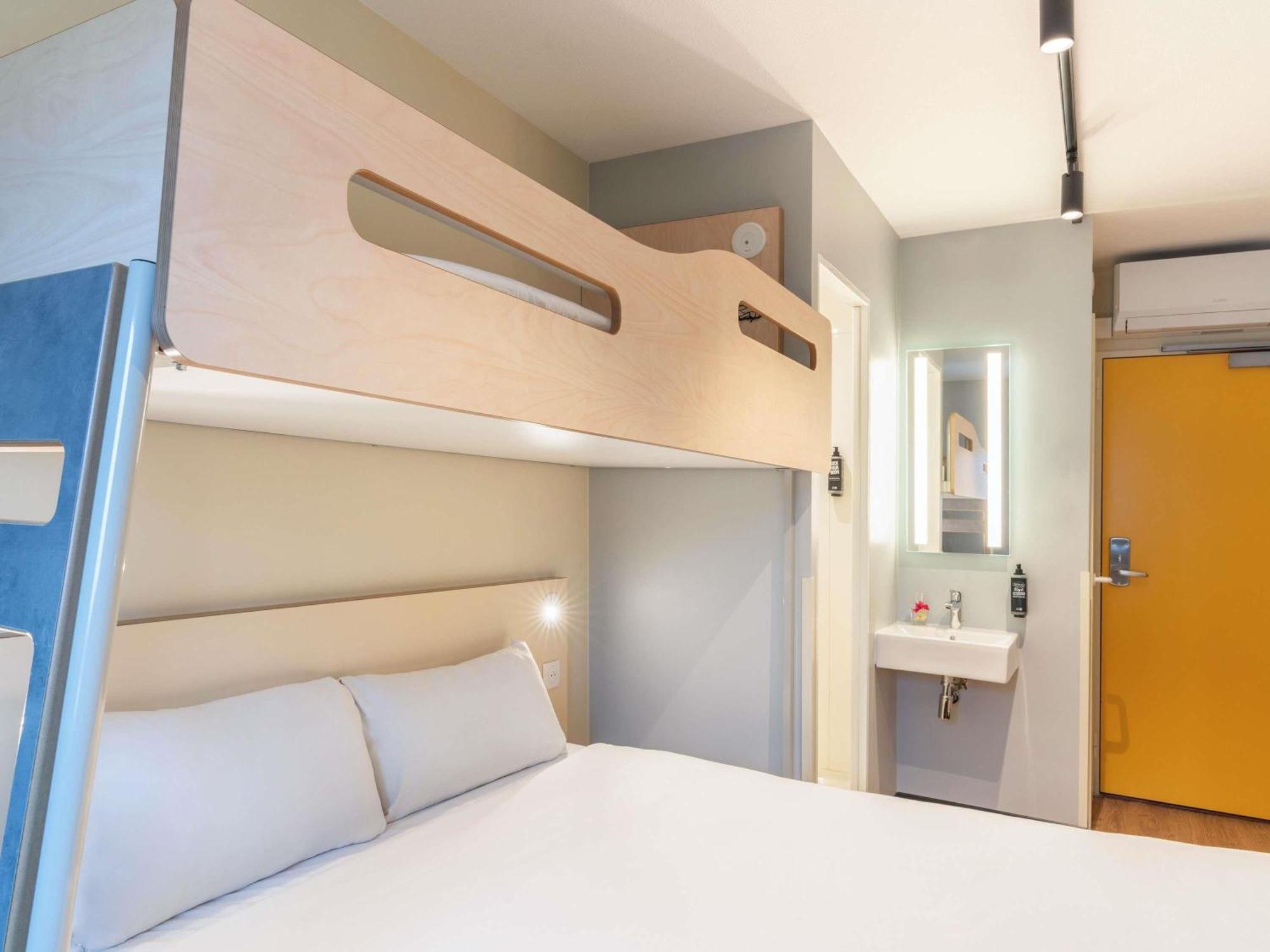 Room with One Queen Bed and One Bunk Bed